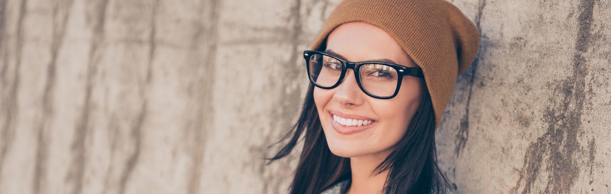 woman wearing glasses and hat